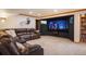 Cozy media room with plush leather seating and large screen perfect for movie nights at 15946 W Ellsworth Ln, Golden, CO 80401