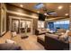 Inviting covered patio with comfortable lounge seating, a ceiling fan, and backyard views at 15946 W Ellsworth Ln, Golden, CO 80401