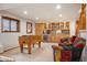 Spacious recreation room with foosball table, bar area, and comfortable seating at 15946 W Ellsworth Ln, Golden, CO 80401