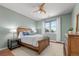 Serene bedroom with wood-look floors, a ceiling fan, a window, and a well-lit space, creating a peaceful retreat at 837 E 98Th Ave # 405, Thornton, CO 80229