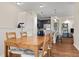Open-concept dining area seamlessly connects the kitchen, features wood floors, and provides ample space for Gathering gatherings at 837 E 98Th Ave # 405, Thornton, CO 80229