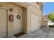 Front door with welcome mat, wreath, and an adjacent storage door to the right at 837 E 98Th Ave # 405, Thornton, CO 80229