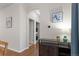 Hallway view with dark wood floor, leading to laundry and additional rooms at 837 E 98Th Ave # 405, Thornton, CO 80229