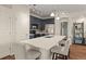 Stylish kitchen with a quartz island, stainless steel appliances, and modern lighting fixtures at 837 E 98Th Ave # 405, Thornton, CO 80229