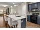 Bright kitchen with a quartz island, stainless steel appliances, and modern lighting fixtures at 837 E 98Th Ave # 405, Thornton, CO 80229
