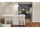 Well-lit kitchen featuring a large island with seating, stainless steel appliances, and modern cabinetry at 837 E 98Th Ave # 405, Thornton, CO 80229