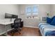 Bright office space featuring a modern desk setup and comfortable daybed at 837 E 98Th Ave # 405, Thornton, CO 80229
