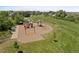 Aerial shot of a colorful playground with swings, slides, and picnic area, perfect for Gathering fun at 837 E 98Th Ave # 405, Thornton, CO 80229