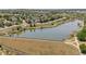 Aerial view of a pond surrounded by walking paths and lush vegetation, creating a serene community space at 837 E 98Th Ave # 405, Thornton, CO 80229