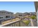 Landscaped backyard with lush grass, fenced perimeter, and stone patio areas for outdoor entertaining at 1832 Marlowe Cir, Erie, CO 80516