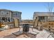 Cozy backyard patio setup with chairs and a fire pit, ideal for relaxation and socializing at 1832 Marlowe Cir, Erie, CO 80516