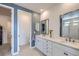 Elegant bathroom features double sinks, quartz counters, and a separate toilet room for added privacy at 1832 Marlowe Cir, Erie, CO 80516