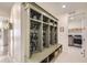Organized mudroom with built-in storage cubbies, hooks, and bench seating, adding functionality and style at 1832 Marlowe Cir, Erie, CO 80516