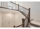 Modern staircase with elegant wrought iron railings and plush carpet leading to upper level at 1832 Marlowe Cir, Erie, CO 80516