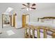 Spacious bedroom boasts a unique log bed, plush carpet, and a skylight, enhancing the bright, airy feel with natural light at 800 Highway 72, Golden, CO 80403