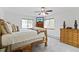 Inviting bedroom features rustic log bed, plush carpet, and a large window that offers scenic views of the surrounding nature at 800 Highway 72, Golden, CO 80403