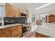 Chef's kitchen with granite countertops, stainless appliances and dark backsplash, offering a stylish cooking space at 800 Highway 72, Golden, CO 80403