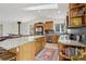 Spacious kitchen featuring a granite island, stainless steel appliances, and custom wood cabinets at 800 Highway 72, Golden, CO 80403