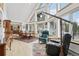 Bright living room with large windows, rustic decor, and comfortable seating, perfect for enjoying the view at 800 Highway 72, Golden, CO 80403