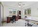 Home office with two workstations and views of the trees through the windows at 800 Highway 72, Golden, CO 80403