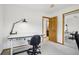 Bright, carpeted office with a functional desk, sliding door closet, and lots of light at 800 Highway 72, Golden, CO 80403