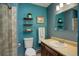 The bathroom features a glass-door shower, toilet, sink, and natural light window at 31150 Manitoba Dr, Evergreen, CO 80439