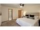 Bedroom boasts neutral walls, soft carpet, and an ensuite bathroom entrance at 31150 Manitoba Dr, Evergreen, CO 80439
