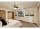 Bedroom features include carpet, neutral paint, natural light and double door closets at 31150 Manitoba Dr, Evergreen, CO 80439