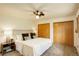 Spacious bedroom featuring two closets, carpet, neutral paint, and a window at 31150 Manitoba Dr, Evergreen, CO 80439