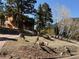 Exterior view of home with natural landscape and wildlife in a mountain setting at 31150 Manitoba Dr, Evergreen, CO 80439