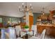 View of the kitchen and living room featuring dark green accent walls at 31150 Manitoba Dr, Evergreen, CO 80439