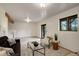Inviting living room featuring a modern fireplace, bright lighting and neutral decor at 31150 Manitoba Dr, Evergreen, CO 80439