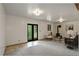 Spacious living room with a cozy fireplace, outdoor access, and neutral tones at 31150 Manitoba Dr, Evergreen, CO 80439