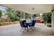 Covered back patio provides a comfortable outdoor living space with stylish seating and a swing at 10373 W 75Th Ave, Arvada, CO 80005