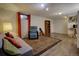 Open basement featuring recessed lighting, a window for natural light, and a cozy seating area at 10373 W 75Th Ave, Arvada, CO 80005
