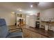 Basement area with essential appliances including a refrigerator and a utility sink at 10373 W 75Th Ave, Arvada, CO 80005