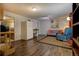 Finished basement offers a comfortable living area with wood-look flooring and stylish decor at 10373 W 75Th Ave, Arvada, CO 80005