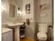 Charming bathroom with a pedestal sink, classic fixtures, and decorative accents at 10373 W 75Th Ave, Arvada, CO 80005