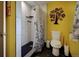 Bathroom with shower and modern fixtures. Accented by a modern art piece at 10373 W 75Th Ave, Arvada, CO 80005
