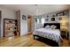 Serene bedroom with hardwood floors, a comfortable bed, and tasteful decor at 10373 W 75Th Ave, Arvada, CO 80005