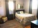 Bedroom featuring a large window and a cozy reading corner, perfect for relaxing at 10373 W 75Th Ave, Arvada, CO 80005