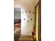 A decorative coat rack and a door with a glass insert accent this bright and welcoming foyer at 10373 W 75Th Ave, Arvada, CO 80005