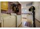Functional laundry area includes a washer, dryer, and convenient access to the kitchen at 10373 W 75Th Ave, Arvada, CO 80005
