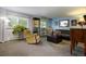 Bright living room with a comfortable sofa, stylish decor, and plenty of natural light at 10373 W 75Th Ave, Arvada, CO 80005