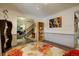 Open-concept living room showcasing wood floors and access to the staircase and kitchen at 10373 W 75Th Ave, Arvada, CO 80005