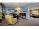 Cozy living room with a comfortable armchair, stylish furniture, and ample natural light at 10373 W 75Th Ave, Arvada, CO 80005