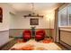 Bright living room with warm lighting, comfortable seating, and a large area rug at 10373 W 75Th Ave, Arvada, CO 80005