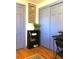 Cozy room with blue doors, wood floors, and desk; a tranquil and efficient workspace at 10373 W 75Th Ave, Arvada, CO 80005