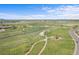 Picturesque aerial view of neighborhood amenities, showing green fields, walking paths, and recreation areas at 1513 Cannon Mountain Dr, Longmont, CO 80503
