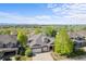 Charming two-story brick home with a well-maintained lawn and mountain views in a peaceful, green neighborhood at 1513 Cannon Mountain Dr, Longmont, CO 80503